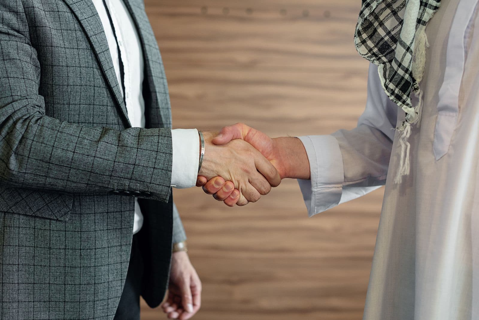 Cross-border business partnership handshake